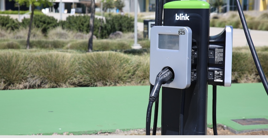 An electric vehicle charger on the UC Merced campus is shown.